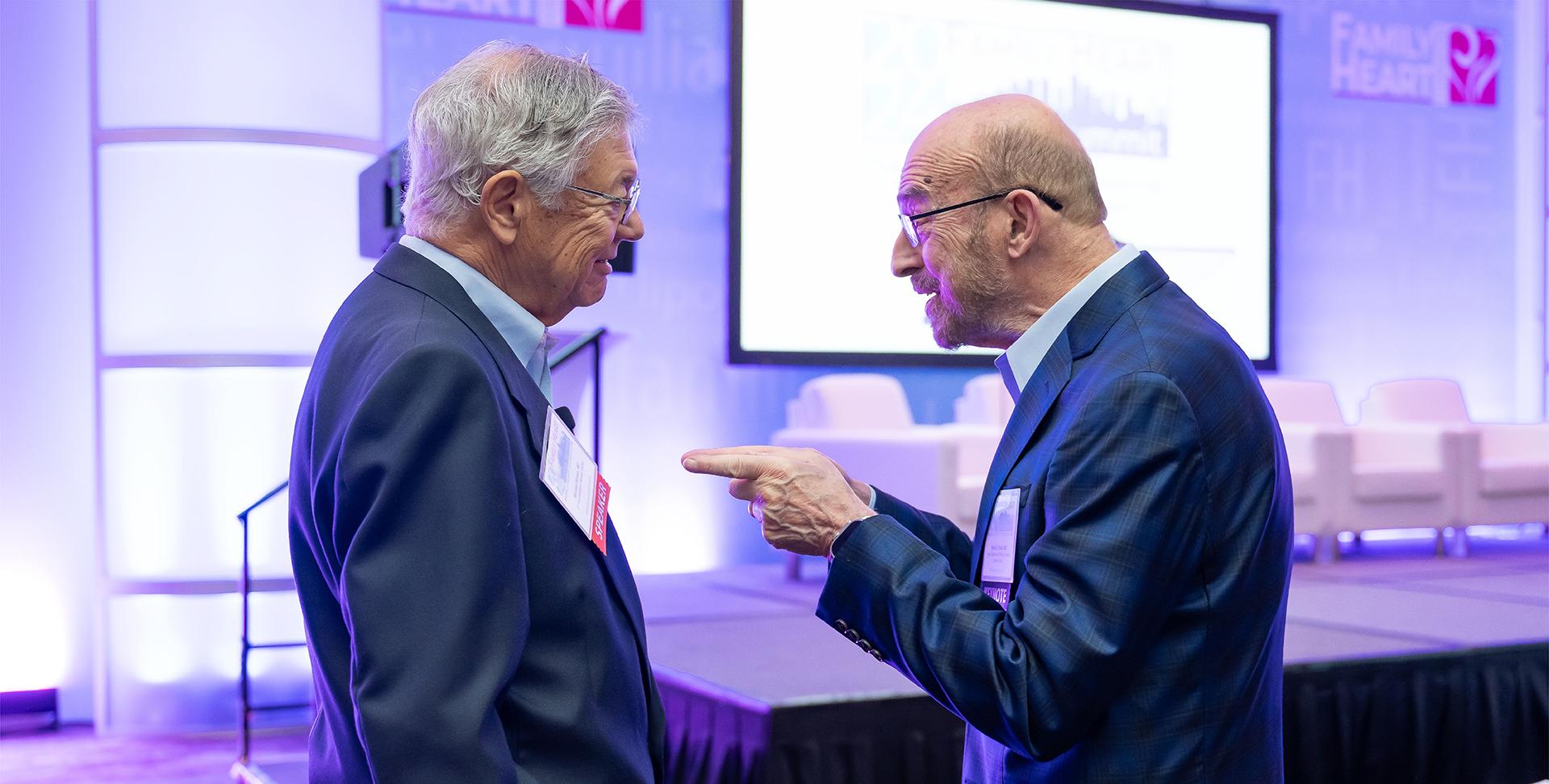 Two older men having a conversation